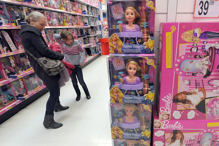 A woman and a little girl look at dolls on November 30, 2011, in a giant toys store in Strasbourg, e...