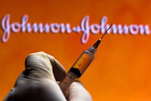 BRAZIL - 2020/11/13: In this photo illustration a medical syringe is seen with Johnson and Johnson c...