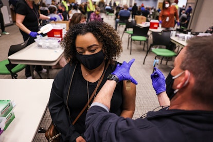 THORNTON, CO - MARCH 06: Latiah Haley receives a dose of the Johnson & Johnson COVID-19 vaccine, the...