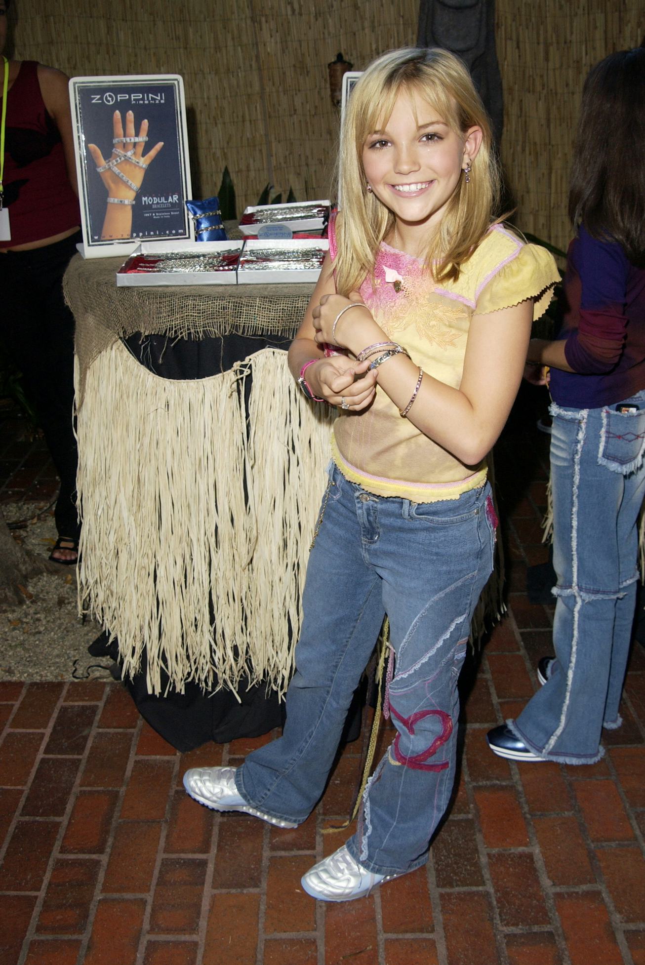 Jamie Lynn Spears with a Zoppini bracelet during The 2002 Teen Choice Awards - Backstage Creations T...