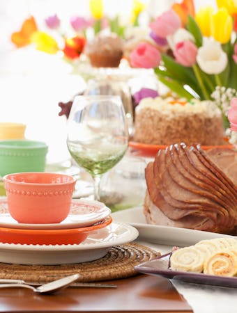 Easter ham brunch. Dining Table with a Centerpiece of Fresh Colorful Tulips