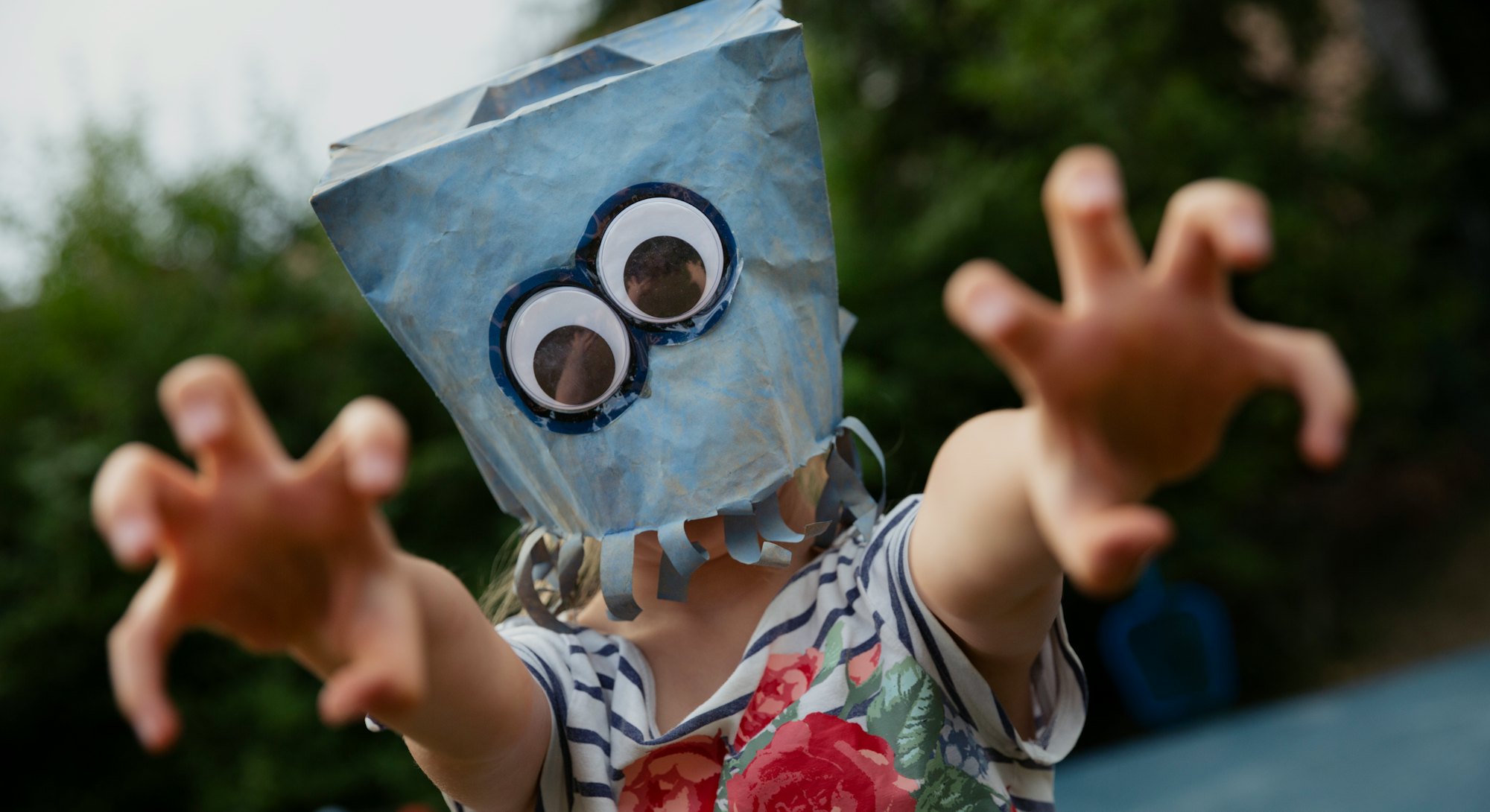Add googly eyes to a paper bag for a monster mask.