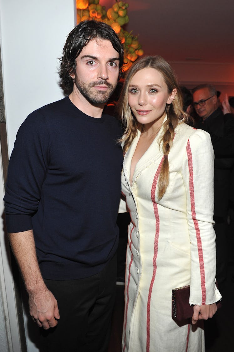 LOS ANGELES, CA - JANUARY 04: Robbie Arnett (L) and Elizabeth Olsen attend W Magazine's Celebration...