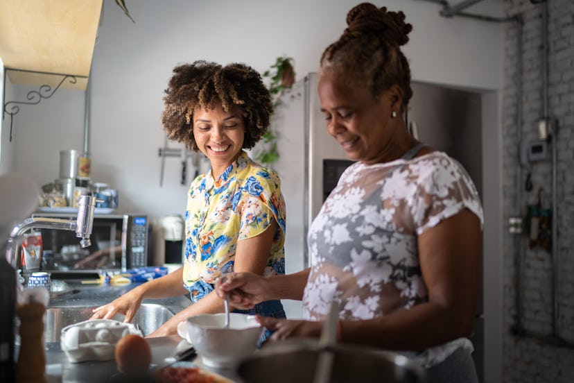 Mother and daughter cooking together at home