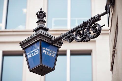 Close-up of a traditional police lantern, on display outside a police station in central London, Eng...