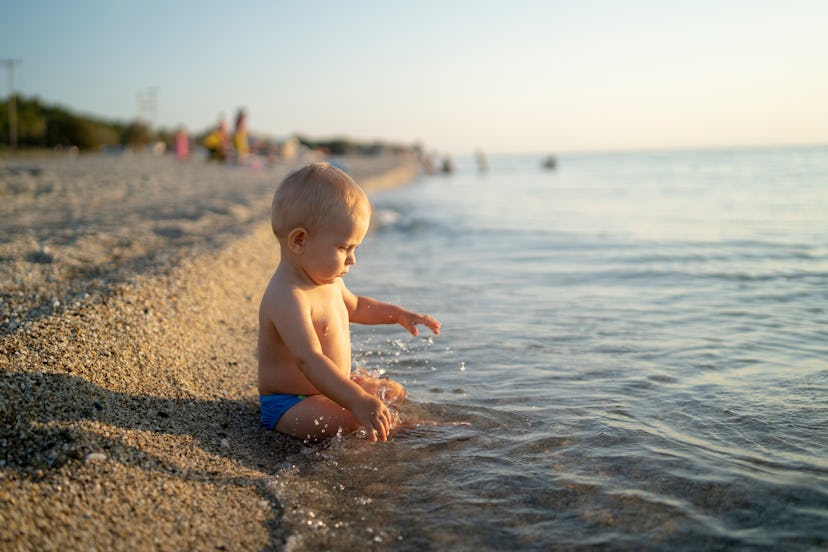 Look out for signs of overheating and dehydration while your baby's on the beach.