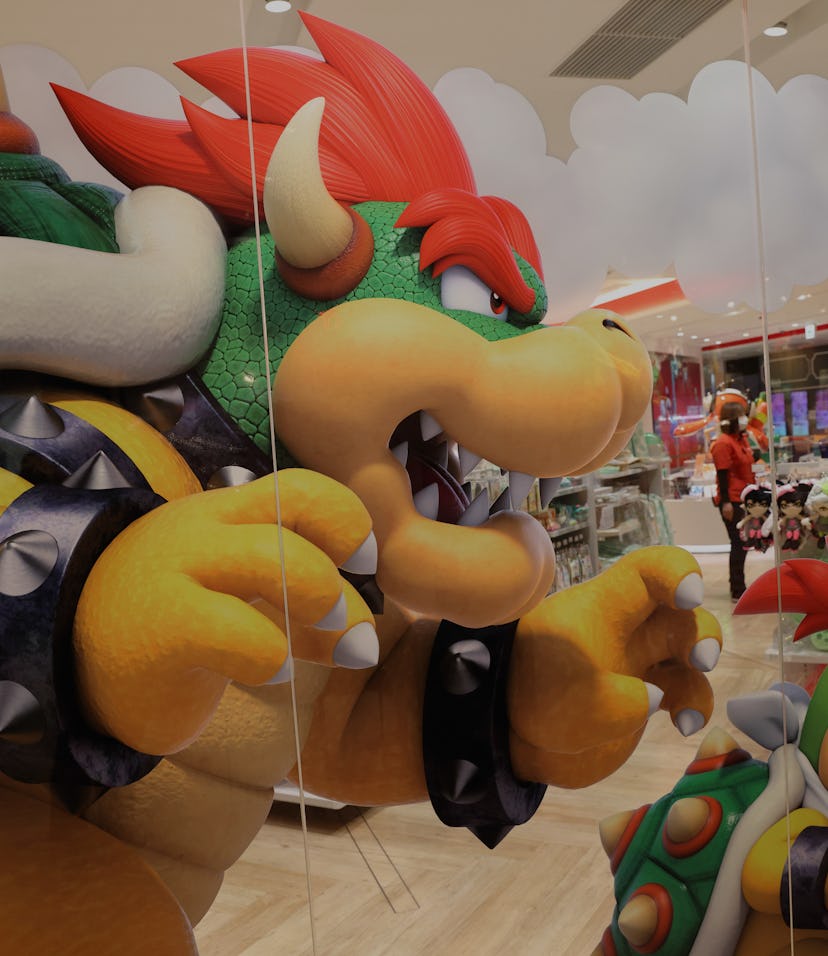 TOKYO, JAPAN - 2021/03/03: Decorative Bowser sticker on a glass wall inside Nintendo Tokyo store in ...
