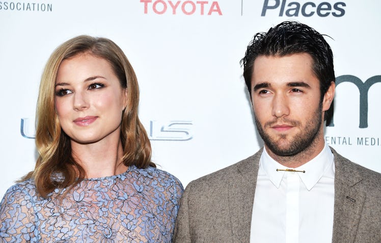 BURBANK, CA - OCTOBER 18: Actress Emily VanCamp (L) and actor Joshua Bowman arrive at the 2014 Envi...