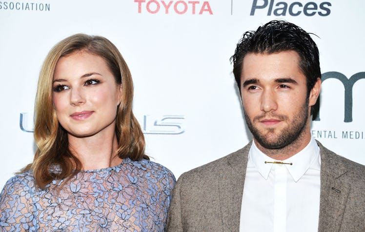 BURBANK, CA - OCTOBER 18:  Actress Emily VanCamp (L) and actor Joshua Bowman arrive at the 2014 Envi...