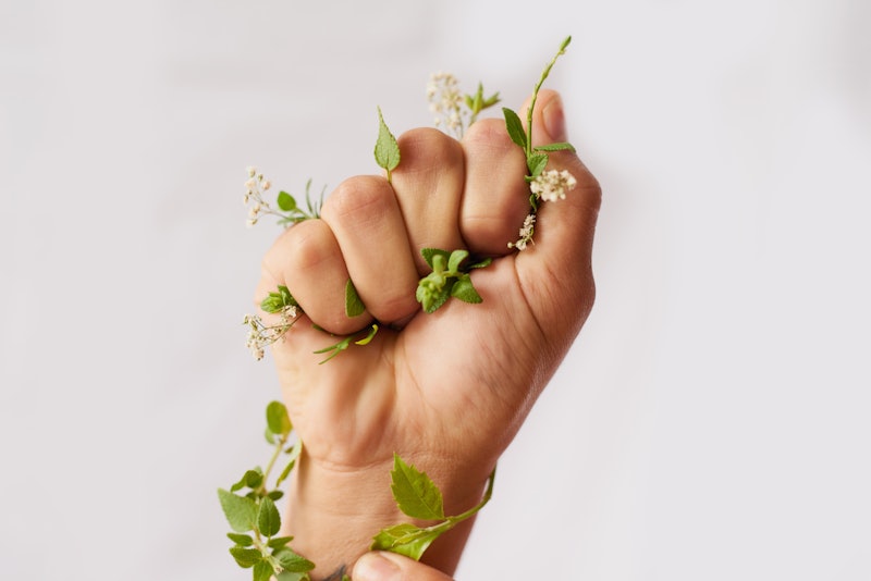 Cropped shot of an woman's hand clenching flowers in a fist. Doctors explain what it means if you ha...