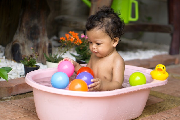 Add a bunch of different colored balls to your baby's play area for sensory activities.