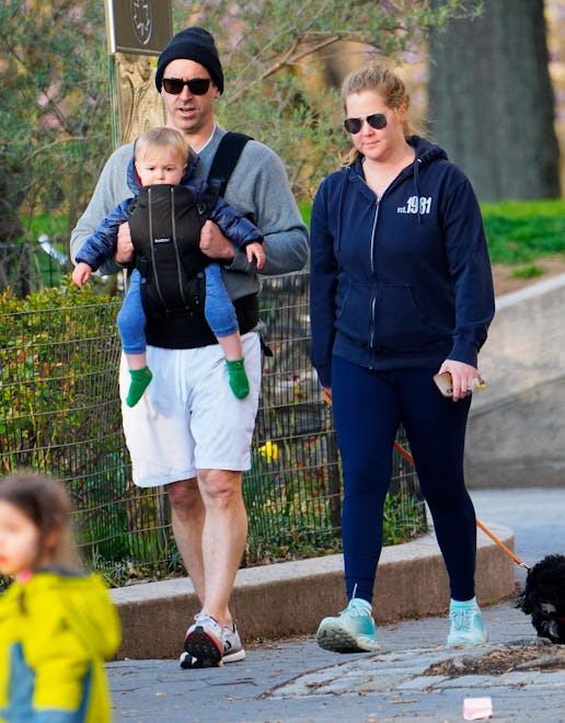 NEW YORK, NEW YORK - APRIL 01: Amy Schumer and husband Chris Fischer take a walk in the park with th...