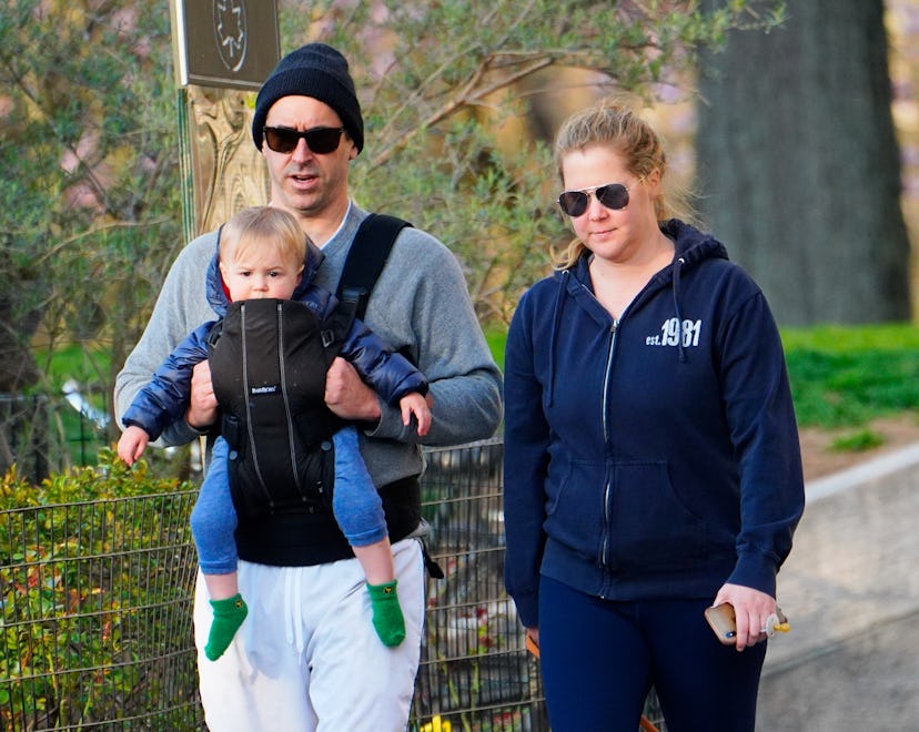 NEW YORK, NEW YORK - APRIL 01: Amy Schumer and husband Chris Fischer take a walk in the park with th...