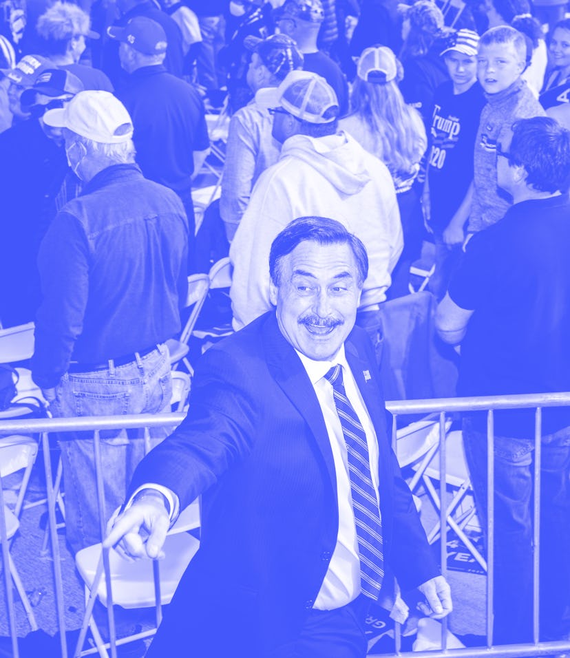 BEMIDJI, MN - SEPTEMBER 18: Mike Lindell (L), founder of My Pillow Inc., points to the crowd during ...