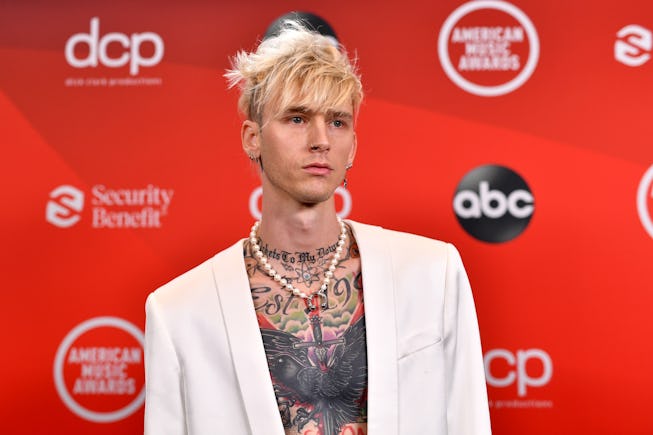 Machine Gun Kelly, founder of new polish brand UN/DN, walks the red carpet at the American Music Awa...