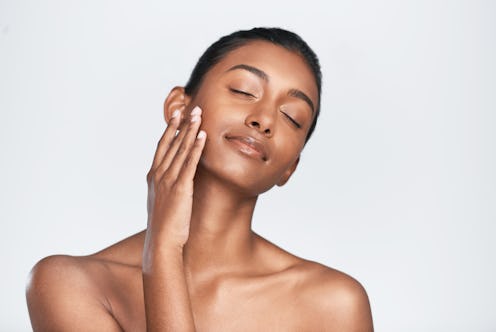 Shot of a beautiful young woman posing against a white background