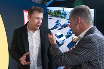 12 November 2019, Berlin: Elon Musk (l), CEO of Tesla, and Herbert Diess, Chairman of the Board of M...
