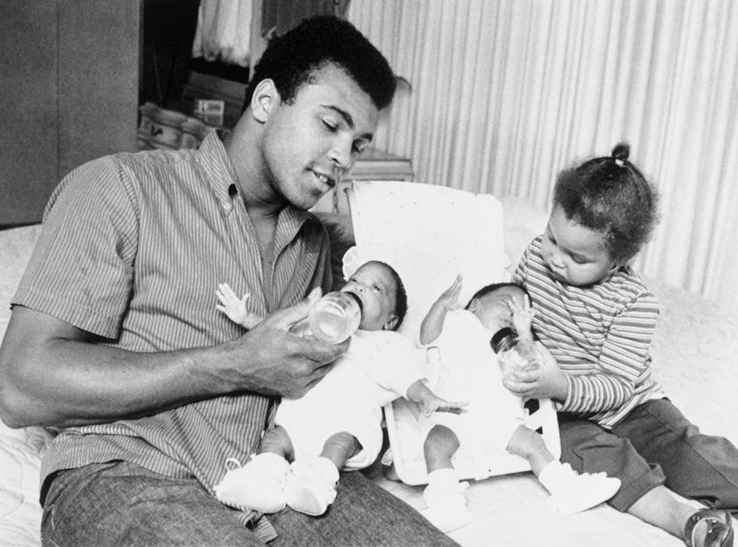 Boxer Mohammad Ali and his daughter, Maryum take time out for some family chores feeding his 10-week...