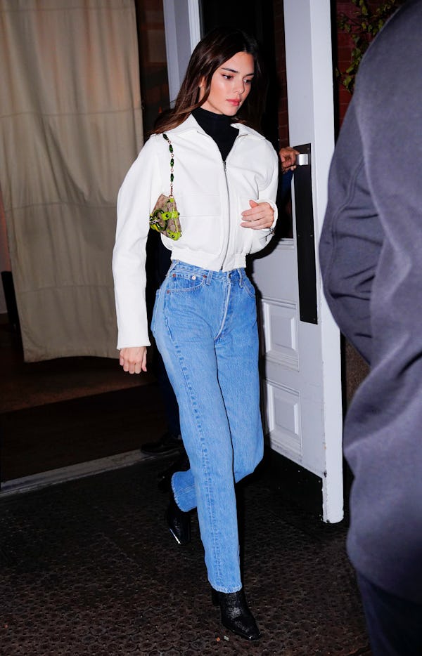 Kendall Jenner wears Gucci Croc Embossed GG Clutch bag in 2019.