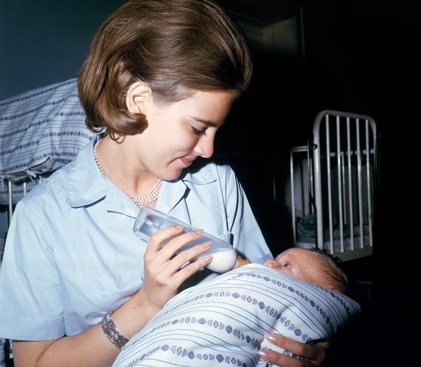 Princess Anne-Marie of Denmark, soon to be Queen Anne-Marie of Greece, learning baby care at a child...