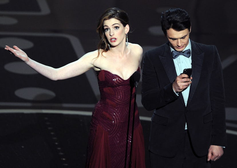 Actors James Franco (R) and Anne Hathaway present the 83rd Annual Academy Awards at the Kodak Theatr...
