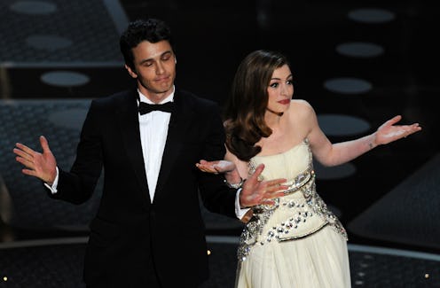 Actor James Franco and actress Anne Hathaway introduce veteran actor Kirk Douglas on stage at the 83...