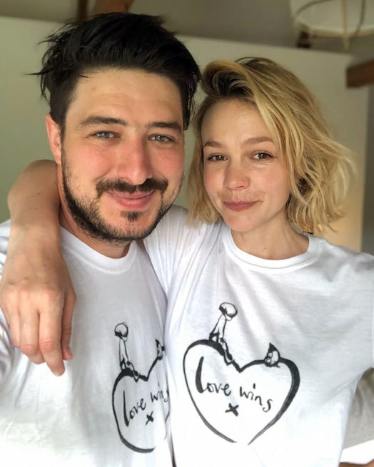 LONDON, ENGLAND - APRIL 20: Marcus Mumford and Carey Mulligan, wearing a limited-edition t-shirt cre...