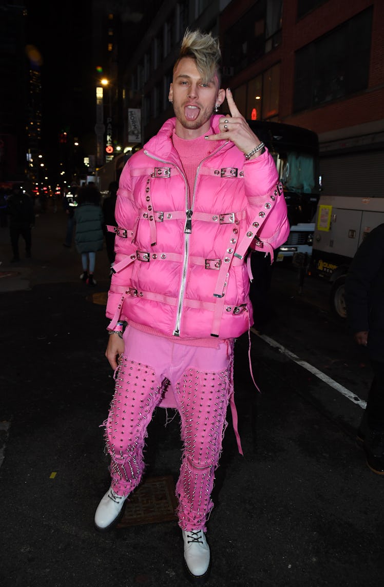NEW YORK, NEW YORK - DECEMBER 31:  Machine Gun Kelly poses in  Times Square during 2021 New Year’s E...