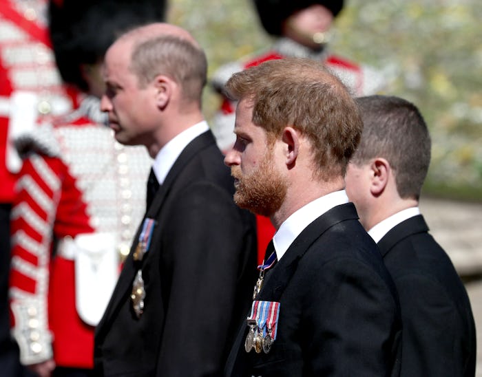 Britain's Prince William, Duke of Cambridge (L) and Britain's Prince Harry, Duke of Sussex follow th...