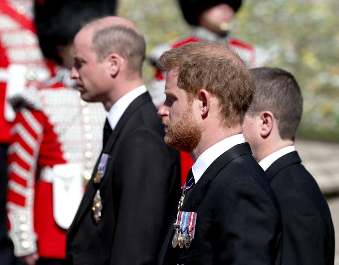 Britain's Prince William, Duke of Cambridge (L) and Britain's Prince Harry, Duke of Sussex follow th...