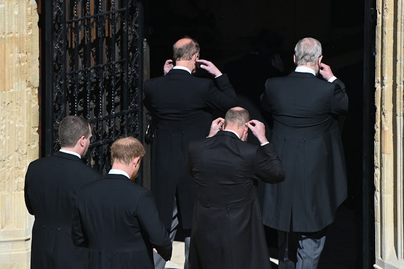 The royal family dons their masks on the way into St. George’s Chapel.