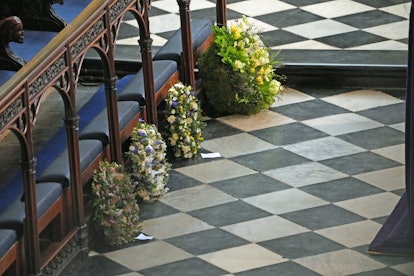 WINDSOR, ENGLAND - APRIL 17: Wreaths from members of the royal family lie against the pews during th...