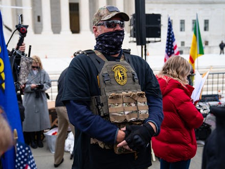 WASHINGTON, DC - JANUARY 05: A member of the right-wing group Oath Keepers stands guard during a ral...
