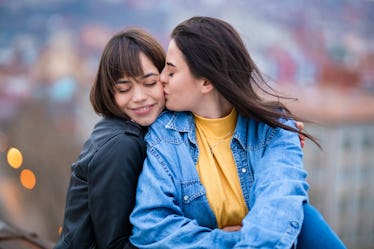 Young lgbt couple embracing and enjoying. Gay couple enjoys in spending time together