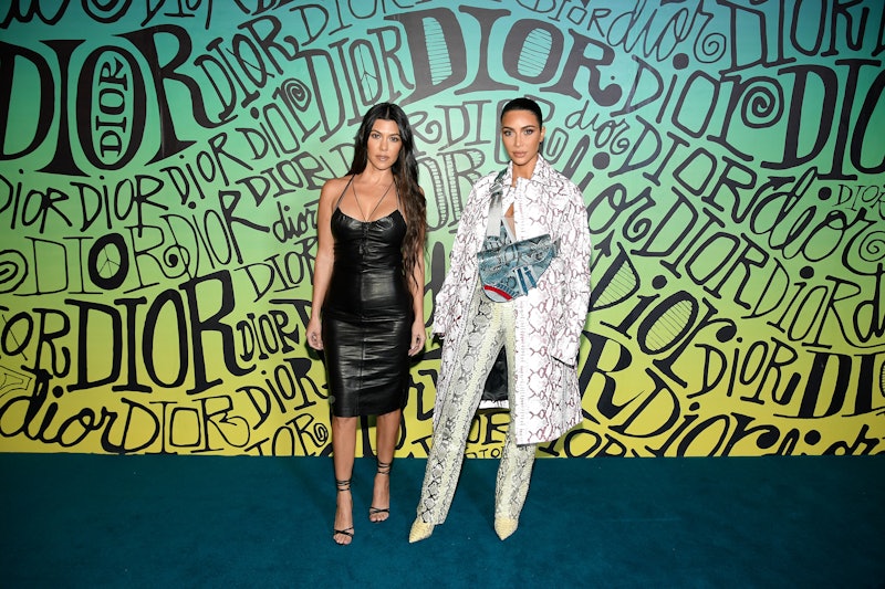 MIAMI, FLORIDA - DECEMBER 03: Kourtney Kardashian and Kim Kardashian West attend the Dior Men's Fall...