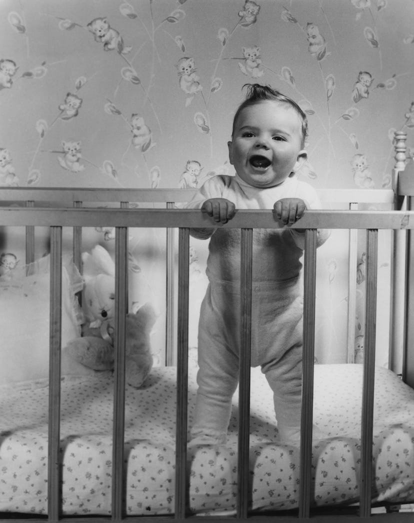 This 1950s baby nursery includes a sweet wallpaper and vintage crib.