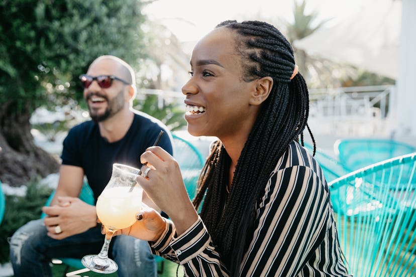 Friends enjoying time together in a outdoor cafe. Connecting with friends in-person will spark new s...