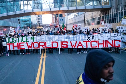 MINNEAPOLIS, MN - APRIL 19: Protesters march around downtown Minneapolis near the courthouse calling...