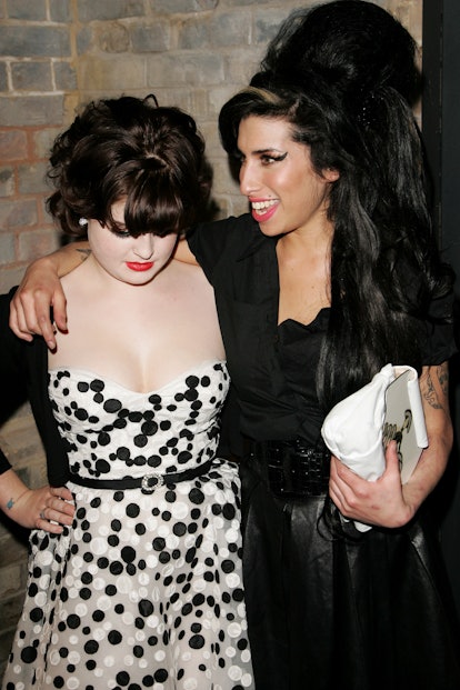LONDON - FEBRUARY 12: Musicians Kelly Osbourne (L) and Amy Winehouse attend the ELLE Style Awards pa...