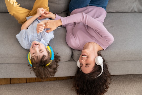 mother and daughter listening to headphones on mother's day