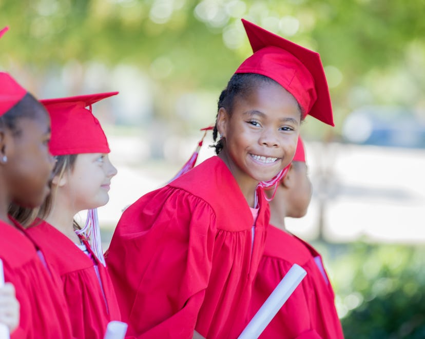 Child wearing cap and gown needs a cute preschool graduation instagram caption