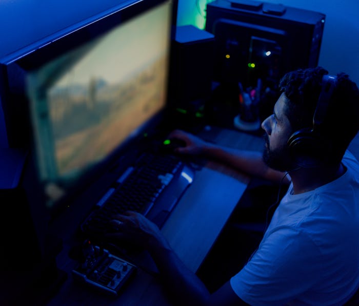 Man playing on the computer. Streamer, gamer.
