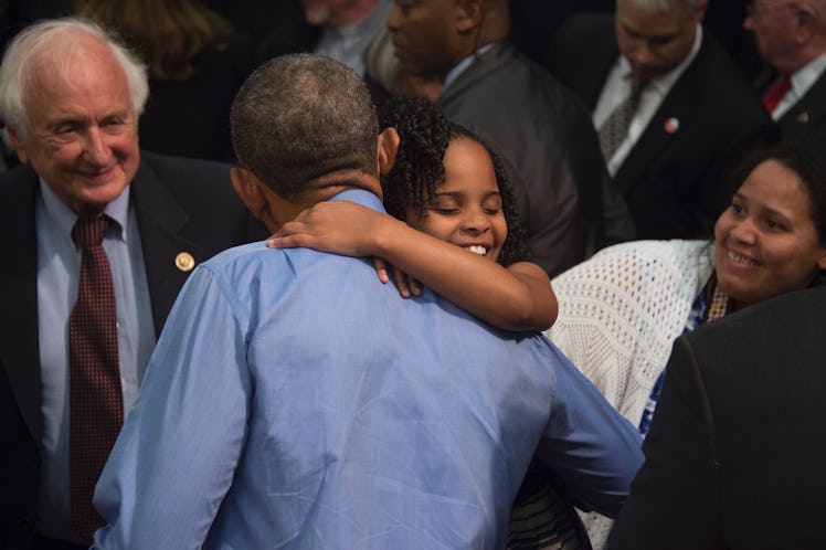 "Little Miss Flint" Mari Copeny, 8, hugs US President Barack Obama during an event at Northwestern H...
