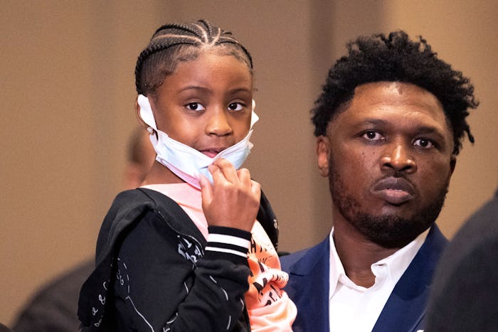George Floyd's 6-year-old daughter Gianna Floyd looks on during a press conference following the ver...
