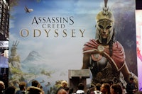 PARIS, FRANCE - OCTOBER 27:  Visitors queue to play the video game  'Assassin's Creed Odyssey' devel...