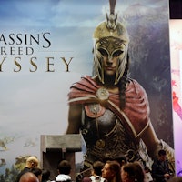 PARIS, FRANCE - OCTOBER 27:  Visitors queue to play the video game  'Assassin's Creed Odyssey' devel...