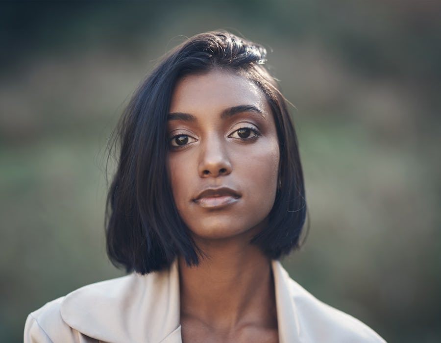 Cropped shot of a beautiful young woman standing outdoors