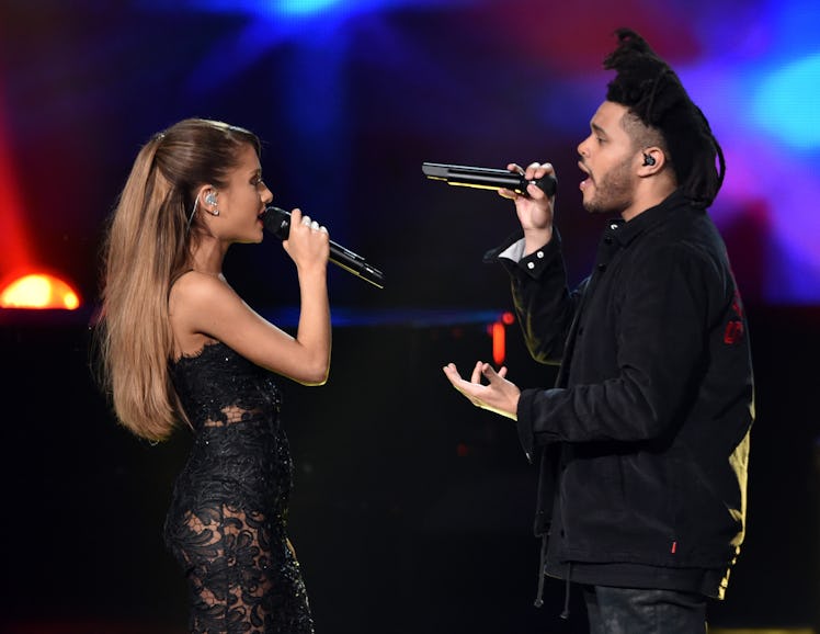 LOS ANGELES, CA - NOVEMBER 23: Recording artists Ariana Grande (L) and The Weeknd perform onstage ...