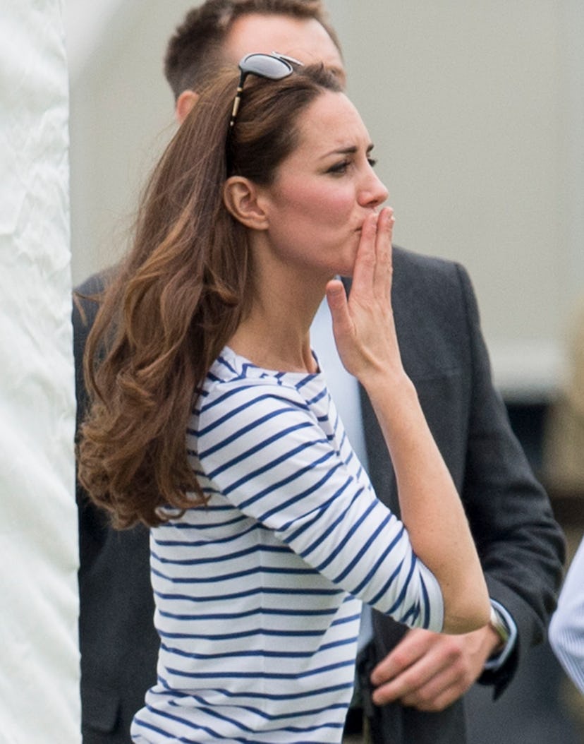 CIRENCESTER, ENGLAND - JUNE 15:  Catherine, Duchess of Cambridge waves goodbye and blows a kiss to P...