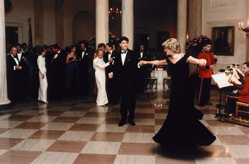 John Travolta twirls Princess Diana on the dance floor while at a White House banquet. Ronald and Na...